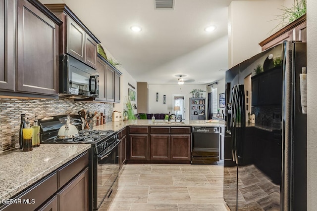 15249 Apex Ct, El Paso, TX 79938 - kitchen featuring black appliances, dark brown cabinetry, decorative backsplash, a peninsula, and recessed lighting
