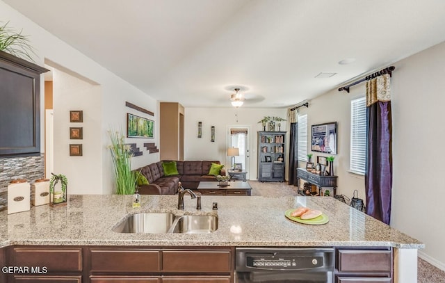 15249 Apex Ct, El Paso, TX 79938 - kitchen with dishwasher, open floor plan, light stone countertops, and dark brown cabinets