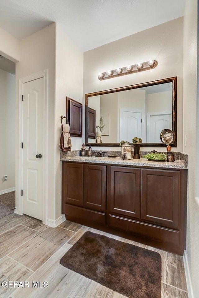 15249 Apex Ct, El Paso, TX 79938 - bathroom featuring vanity and wood finished floors