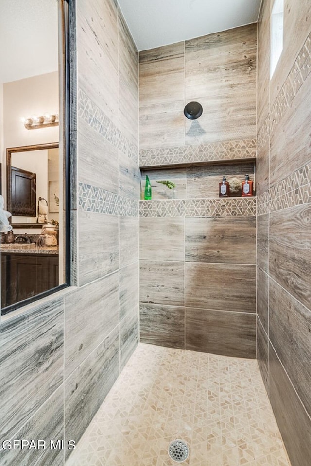 15249 Apex Ct, El Paso, TX 79938 - bathroom featuring a tile shower and vanity
