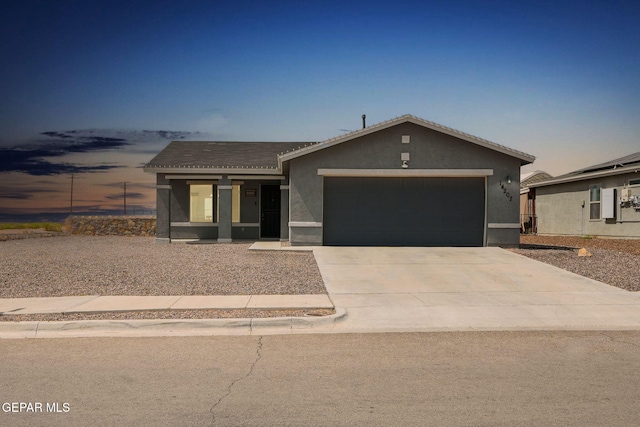 14207 Desierto Bonito St, Horizon City, TX 79928 - ranch-style house with a garage, stucco siding, driveway, and a tile roof