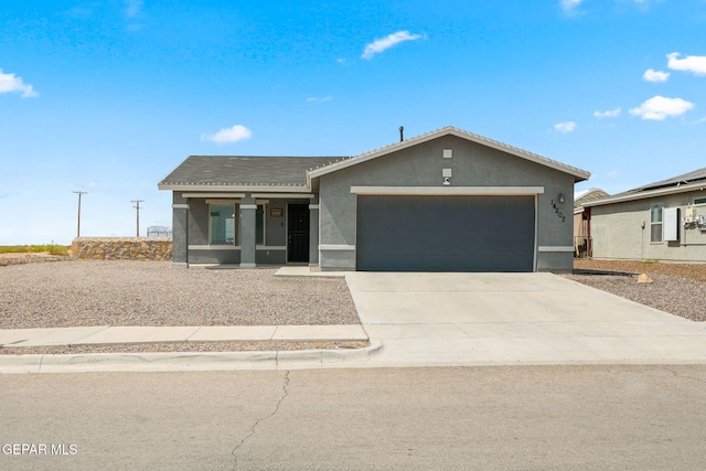 14207 Desierto Bonito St, Horizon City, TX 79928 - single story home with a garage, stucco siding, concrete driveway, and a tiled roof