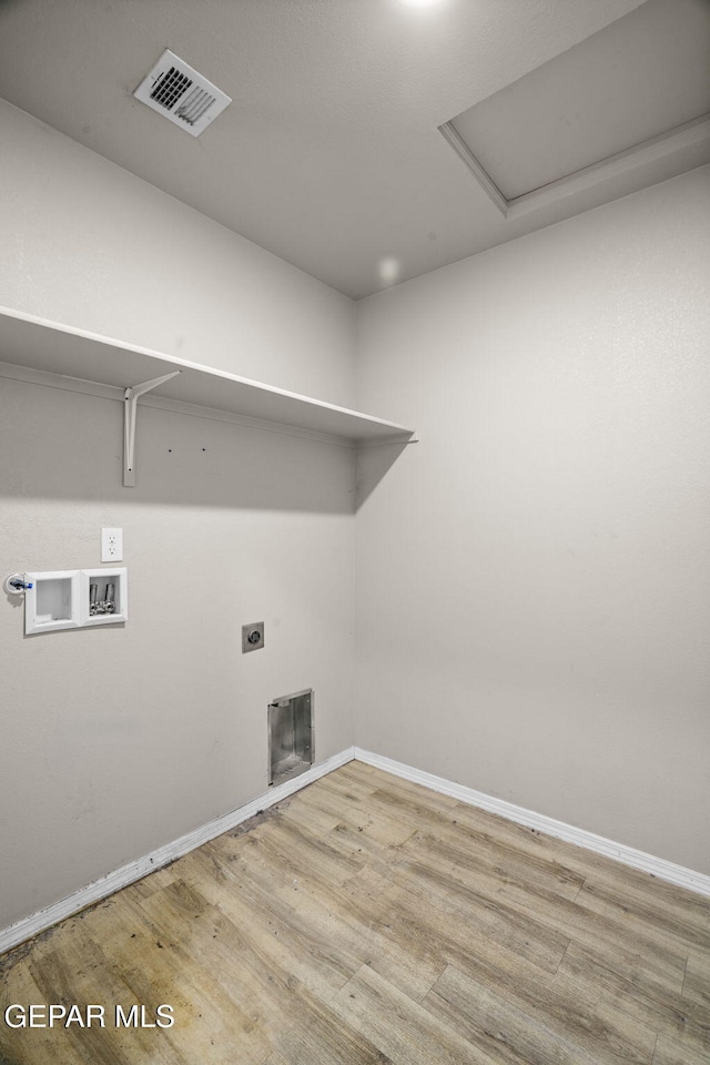 14207 Desierto Bonito St, Horizon City, TX 79928 - laundry area featuring washer hookup, wood finished floors, and hookup for an electric dryer
