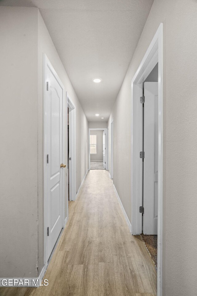 14207 Desierto Bonito St, Horizon City, TX 79928 - corridor featuring light wood finished floors and recessed lighting