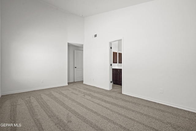 245 Hunstanton St, Horizon City, TX 79928 - carpeted empty room featuring high vaulted ceiling and baseboards