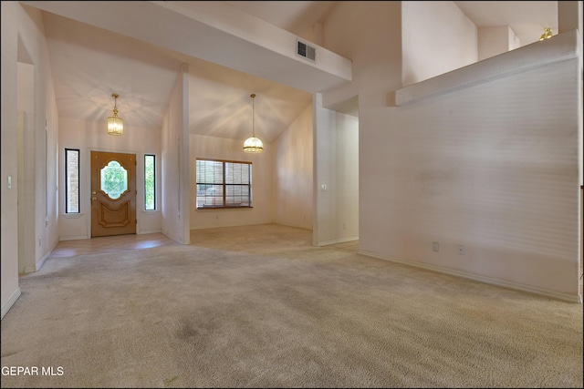 712 Rena Mae Ct, Las Cruces, NM 88005 - foyer entrance featuring light colored carpet, a chandelier, and high vaulted ceiling