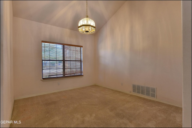 712 Rena Mae Ct, Las Cruces, NM 88005 - spare room featuring carpet, a chandelier, and lofted ceiling