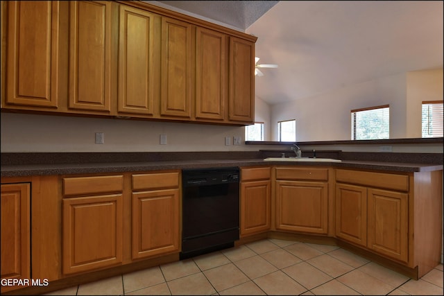 712 Rena Mae Ct, Las Cruces, NM 88005 - kitchen with black dishwasher, lofted ceiling, dark countertops, light tile patterned flooring, and a peninsula