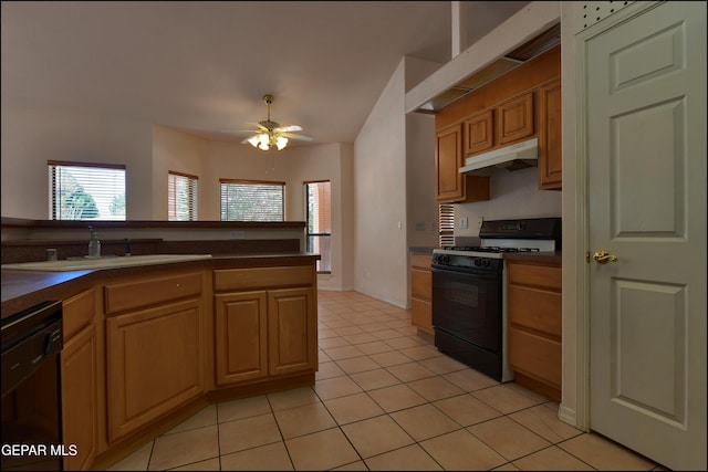 712 Rena Mae Ct, Las Cruces, NM 88005 - kitchen with black appliances, under cabinet range hood, dark countertops, light tile patterned floors, and ceiling fan