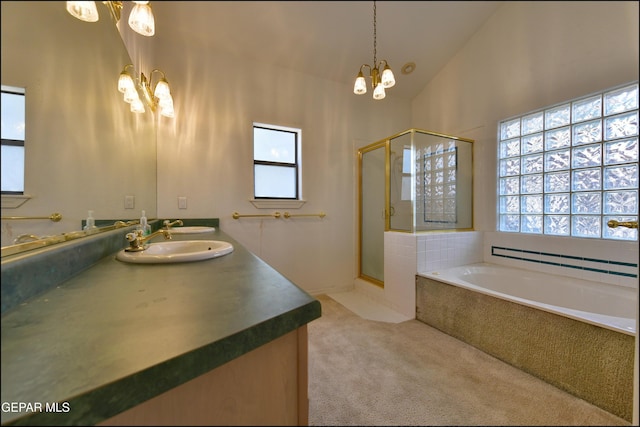 712 Rena Mae Ct, Las Cruces, NM 88005 - bathroom with a chandelier, double vanity, a stall shower, and a bath