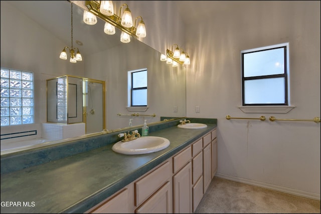 712 Rena Mae Ct, Las Cruces, NM 88005 - bathroom featuring a stall shower, double vanity, a chandelier, and a garden tub