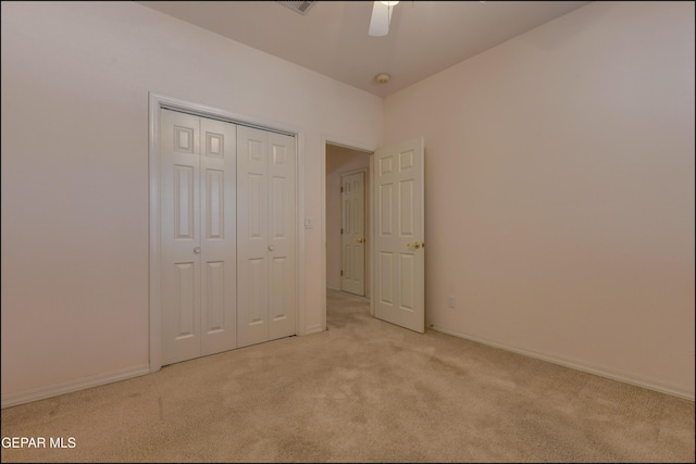 712 Rena Mae Ct, Las Cruces, NM 88005 - unfurnished bedroom with light carpet, a closet, and a ceiling fan