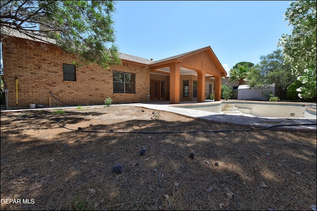712 Rena Mae Ct, Las Cruces, NM 88005 - view of front of home with a patio and brick siding