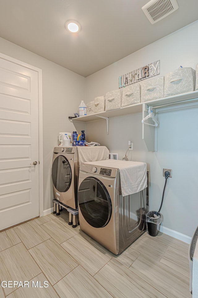 13010 Aberdare Dr, El Paso, TX 79928 - washroom with independent washer and dryer and baseboards