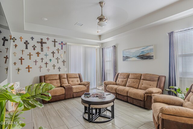 13010 Aberdare Dr, El Paso, TX 79928 - living area featuring a raised ceiling, plenty of natural light, and a ceiling fan