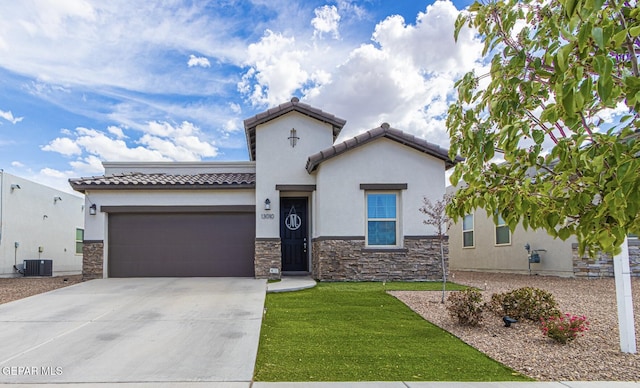 13010 Aberdare Dr, El Paso, TX 79928 - mediterranean / spanish-style house with stucco siding, a garage, stone siding, and concrete driveway