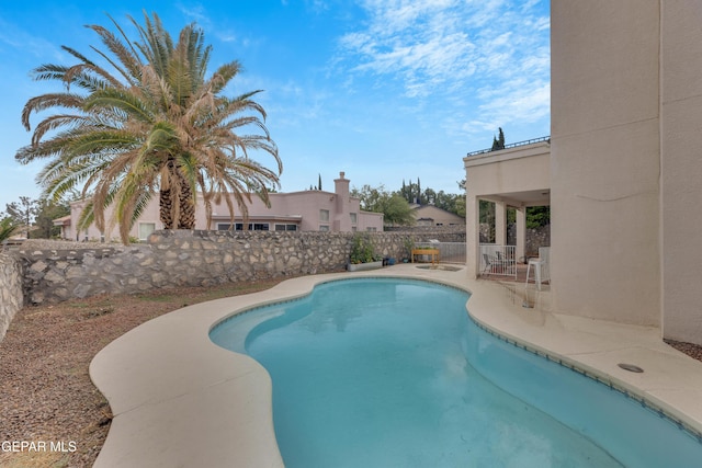 1121 Regal Ridge Dr, El Paso, TX 79912 - view of swimming pool with a fenced backyard and a patio area