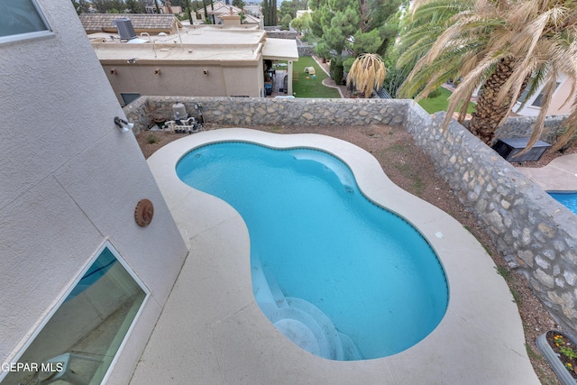 1121 Regal Ridge Dr, El Paso, TX 79912 - outdoor pool featuring a patio area