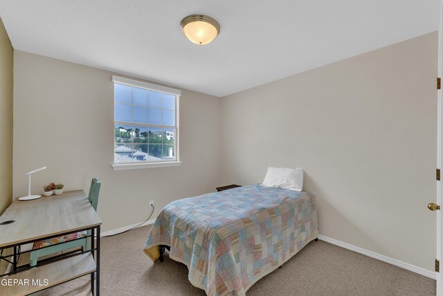 1121 Regal Ridge Dr, El Paso, TX 79912 - bedroom with carpet flooring and baseboards
