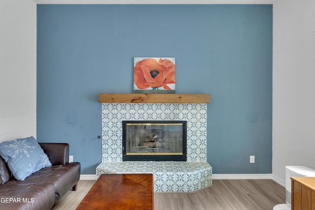 1121 Regal Ridge Dr, El Paso, TX 79912 - living area with wood finished floors and a tile fireplace