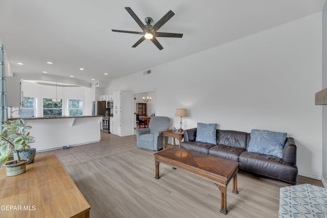 1121 Regal Ridge Dr, El Paso, TX 79912 - living room featuring recessed lighting, ceiling fan, light wood finished floors, a chandelier, and lofted ceiling