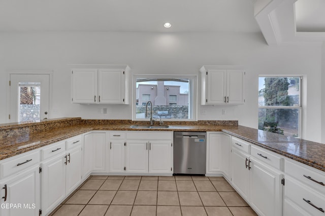 1121 Regal Ridge Dr, El Paso, TX 79912 - kitchen with dishwasher, a peninsula, healthy amount of natural light, white cabinets, and recessed lighting