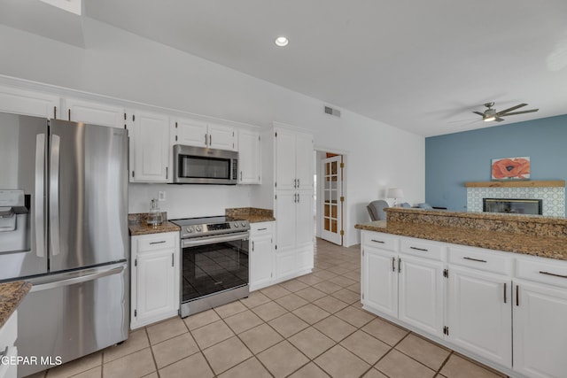 1121 Regal Ridge Dr, El Paso, TX 79912 - kitchen featuring stainless steel appliances, a ceiling fan, light tile patterned floors, white cabinetry, and recessed lighting