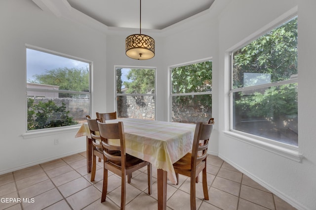 1121 Regal Ridge Dr, El Paso, TX 79912 - dining room with light tile patterned floors, healthy amount of natural light, and a tray ceiling
