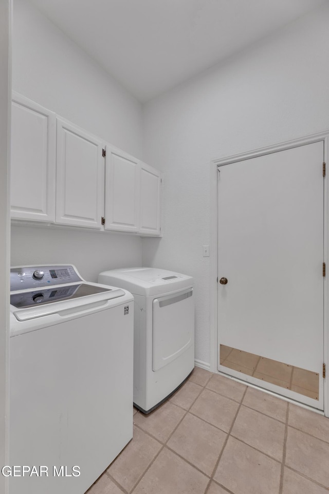 1121 Regal Ridge Dr, El Paso, TX 79912 - washroom with cabinet space, independent washer and dryer, and light tile patterned floors