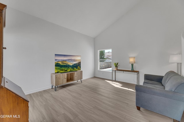 1121 Regal Ridge Dr, El Paso, TX 79912 - living area with high vaulted ceiling and light wood-style floors