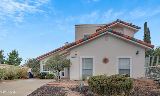 1121 Regal Ridge Dr, El Paso, TX 79912 - mediterranean / spanish-style home featuring stucco siding and a tile roof