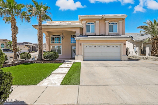 12301 Tierra Limpa Dr, El Paso, TX 79938 - mediterranean / spanish home featuring concrete driveway, stucco siding, a tiled roof, a garage, and a front yard