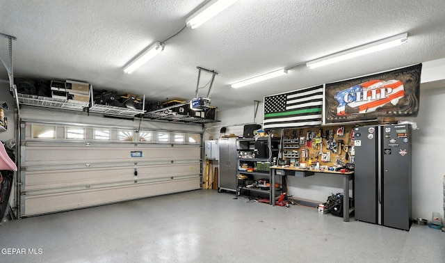 12301 Tierra Limpa Dr, El Paso, TX 79938 - garage featuring a workshop area and a garage door opener