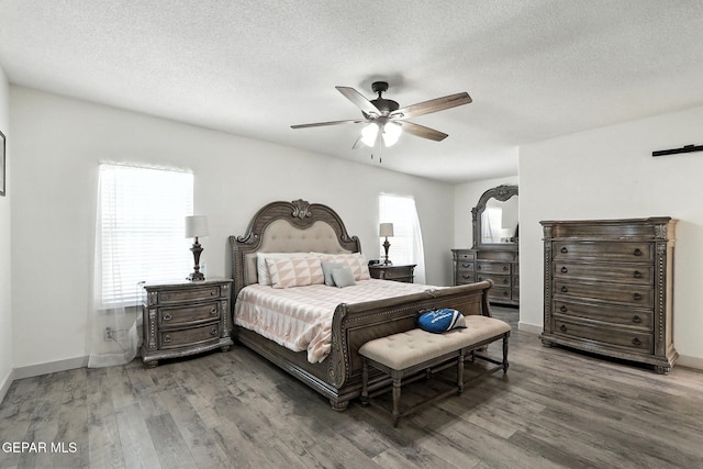 12301 Tierra Limpa Dr, El Paso, TX 79938 - bedroom featuring wood finished floors, a textured ceiling, and a ceiling fan