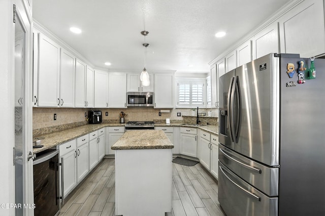 12301 Tierra Limpa Dr, El Paso, TX 79938 - kitchen with appliances with stainless steel finishes, beverage cooler, white cabinetry, wood finish floors, and recessed lighting