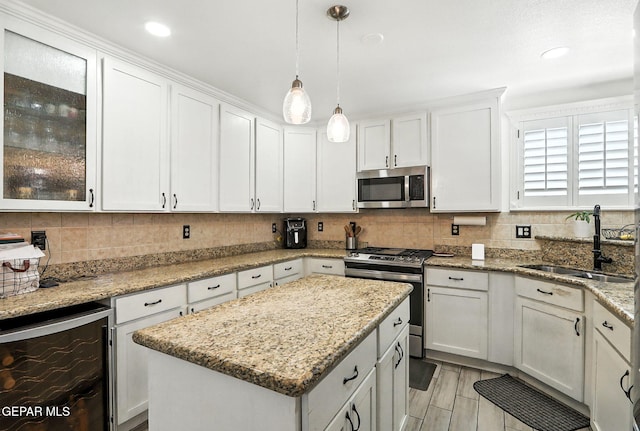12301 Tierra Limpa Dr, El Paso, TX 79938 - kitchen with appliances with stainless steel finishes, beverage cooler, tasteful backsplash, white cabinetry, and recessed lighting