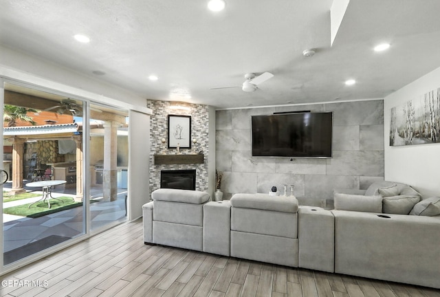 12301 Tierra Limpa Dr, El Paso, TX 79938 - living area with a fireplace, wood finished floors, ceiling fan, and recessed lighting