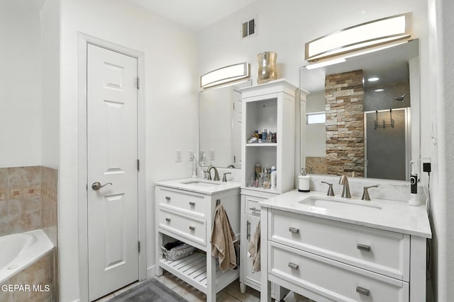 12301 Tierra Limpa Dr, El Paso, TX 79938 - full bathroom featuring two vanities, a garden tub, and a tile shower