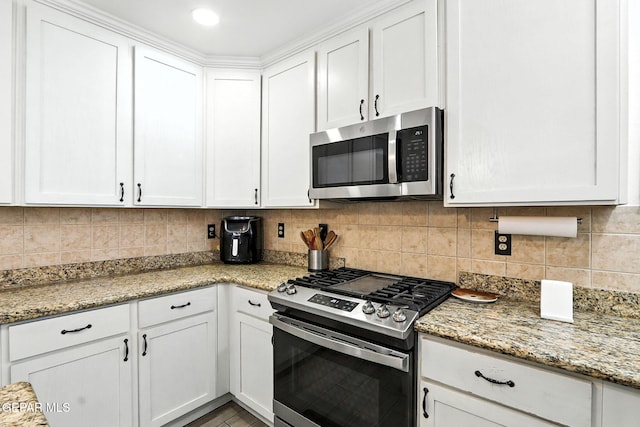 12301 Tierra Limpa Dr, El Paso, TX 79938 - kitchen featuring appliances with stainless steel finishes, white cabinets, backsplash, and light stone counters