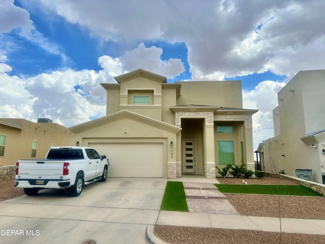 7780 Enchanted Park Dr, El Paso, TX 79911 - view of front of home featuring stone siding, concrete driveway, and stucco siding