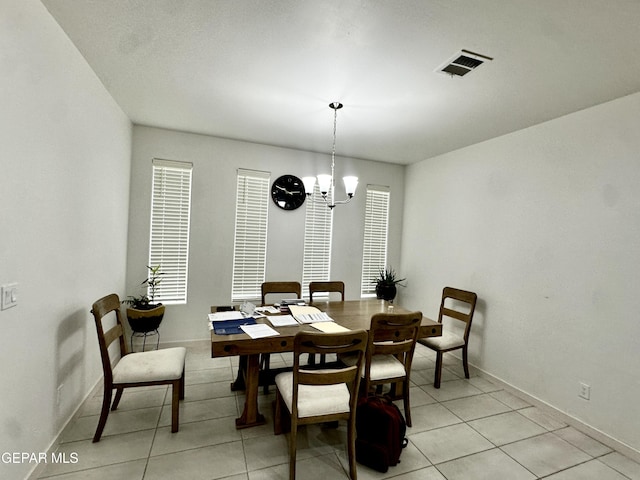 7780 Enchanted Park Dr, El Paso, TX 79911 - dining area with a chandelier and light tile patterned flooring