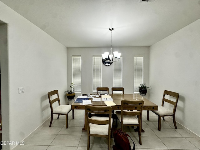 7780 Enchanted Park Dr, El Paso, TX 79911 - dining area featuring a chandelier and light tile patterned flooring