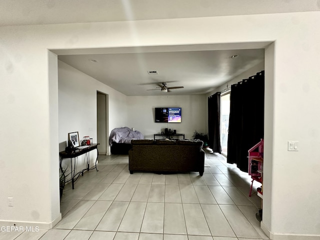 7780 Enchanted Park Dr, El Paso, TX 79911 - living area with ceiling fan and light tile patterned floors