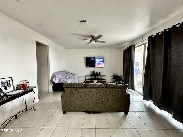 7780 Enchanted Park Dr, El Paso, TX 79911 - living area with ceiling fan and light tile patterned floors