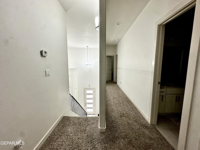 7780 Enchanted Park Dr, El Paso, TX 79911 - hallway with carpet floors and an upstairs landing