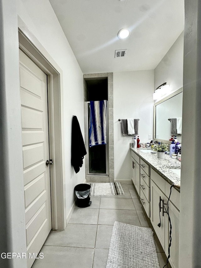 7780 Enchanted Park Dr, El Paso, TX 79911 - bathroom featuring double vanity and tile patterned floors
