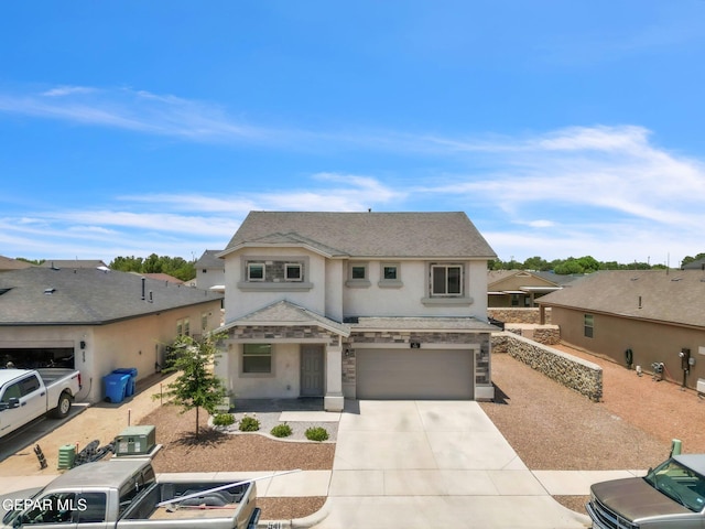 541 Sunset Valley Ave, Socorro, TX 79927 - view of front of house featuring stucco siding, an attached garage, concrete driveway, and stone siding