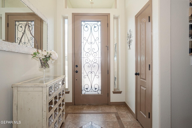 7317 Kiowa Creek Dr, El Paso, TX 79911 - entryway featuring inlaid floor details and baseboards