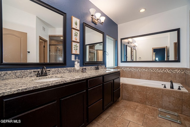 7317 Kiowa Creek Dr, El Paso, TX 79911 - bathroom featuring double vanity, a bath, an enclosed shower, a chandelier, and tile patterned flooring