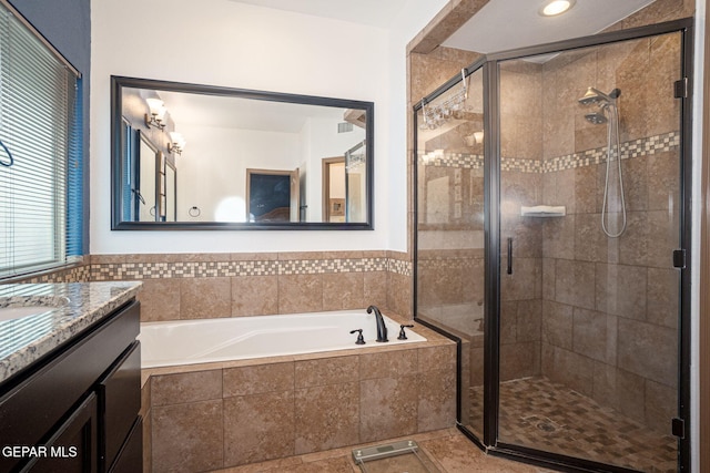 7317 Kiowa Creek Dr, El Paso, TX 79911 - bathroom with vanity, a bath, and a shower stall